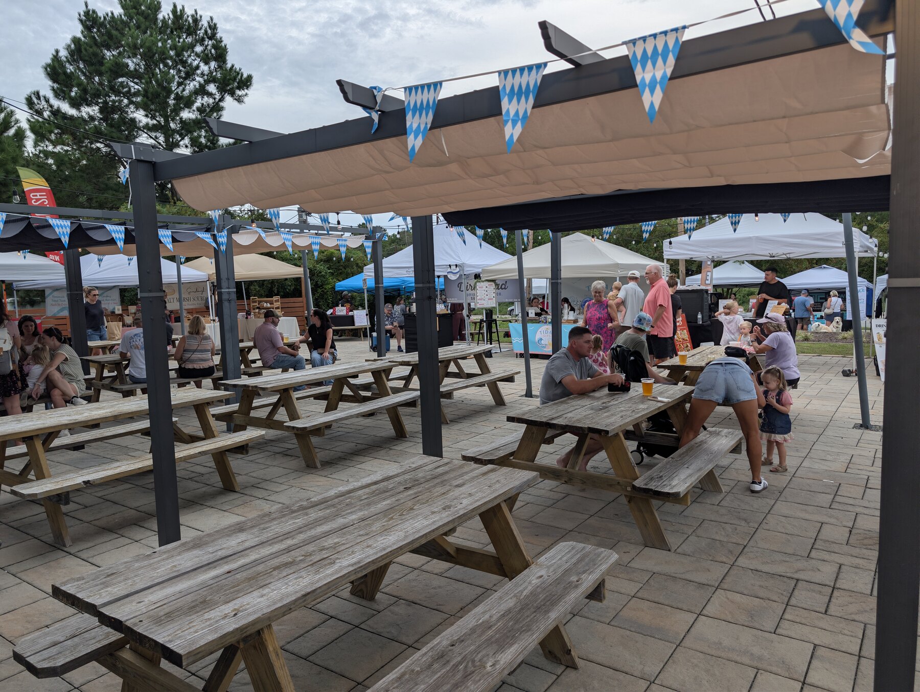 Families and visitors gathered at the market seating area