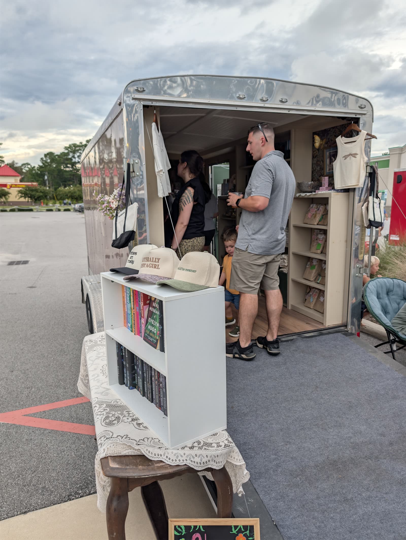 Visitors talking with a vendor at the market