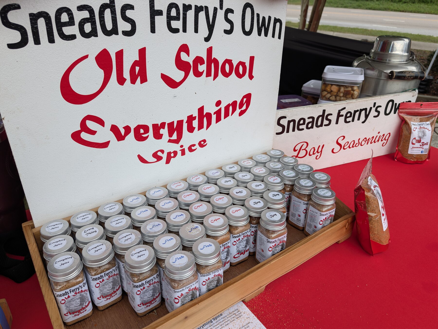 Locally made seasonings displayed by a participating market vendor